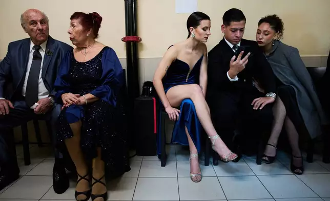Dancers wait backstage before competing in the salon category at the Tango World Championship in Buenos Aires, Argentina, Tuesday, Sept. 1, 2026. (AP Photo/Rodrigo Abd)