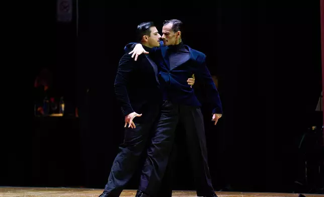 Carlos Cisneros and Juan Segui compete in the stage category at the Tango World Championship in Buenos Aires , Argentina, Wednesday, Sept. 2, 2026. (AP Photo/Rodrigo Abd)