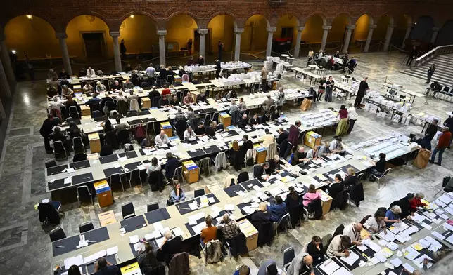 Election workers count early votes and overseas votes in Stockholm City Hall, in Stockholm, Sweden, Wednesday, Sept. 16, 2026. (Christine Olsson/TT News Agency via AP)