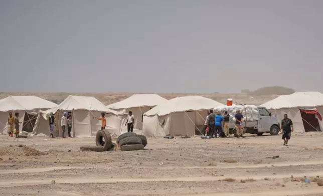 Displaced Yemenis are seen at Al-Firdaws camp in Ras Imran, just outside Aden, Yemen, Monday, Sept. 14, 2026. (AP Photo/Abdulnasser Alseddik)