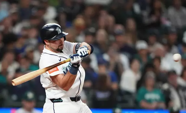 Seattle Mariners' Cal Raleigh hits a single against the Athletics during the fourth inning of a baseball game, Saturday, Sept. 5, 2026, in Seattle. (AP Photo/Lindsey Wasson)