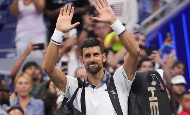 Novak Djokovic, of Serbia, gestures to the crowd after he lost to Mariano Navone, of Argentina, during the first round of the U.S. Open tennis championships Sunday, Aug. 30, 2026, in New York. (AP Photo/Frank Franklin II)