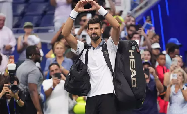 Novak Djokovic, of Serbia, gestures to the crowd after he lost to Mariano Navone, of Argentina, during the first round of the U.S. Open tennis championships Sunday, Aug. 30, 2026, in New York. (AP Photo/Frank Franklin II)