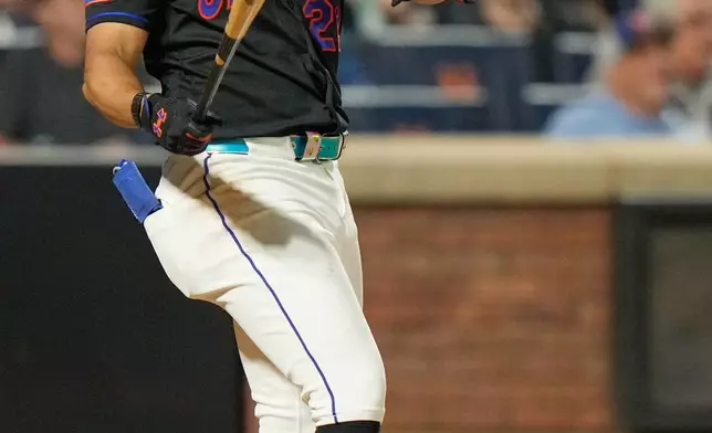 New York Mets' Juan Soto looks after his three-run home run during the sixth inning of a baseball game against the Philadelphia Phillies, Friday, Sept. 18, 2026, in New York. (AP Photo/Seth Wenig)