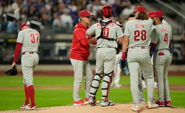 Philadelphia Phillies interim manager Don Mattingly, second from left, pulls pitcher Tim Mayza, left, out of the game during the first inning of a baseball game against the New York Mets, Friday, Sept. 18, 2026, in New York. (AP Photo/Seth Wenig)