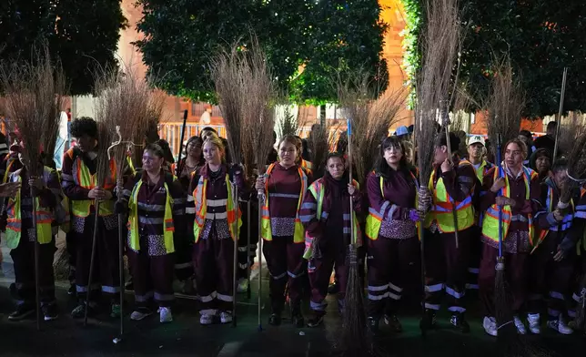 Street cleaners wait to begin their work after President Claudia Sheinbaum gave the annual “Grito de Independencia” to kick off Independence Day celebrations at the Zocalo, Mexico City's main square, Tuesday, Sept. 15, 2026. (AP Photo/Eduardo Verdugo)