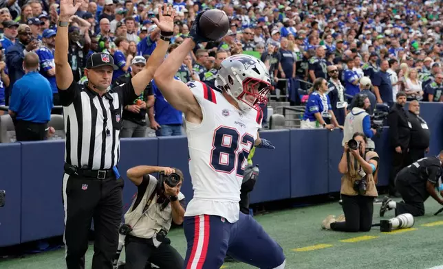 New England Patriots tight end Eli Raridon (82) celebrates after scoring a touchdown during the first half of an NFL football game against the Seattle Seahawks, Wednesday, Sept. 9, 2026, in Seattle. (AP Photo/Stephen Brashear)