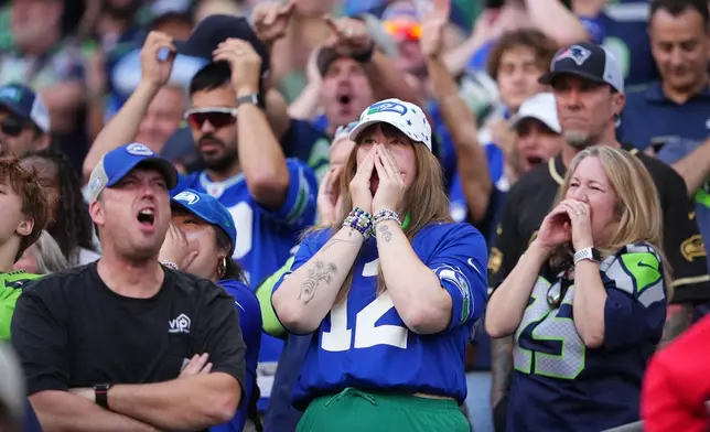 Seattle Seahawks fans reacts during the first half of an NFL football game against the New England Patriots, Wednesday, Sept. 9, 2026, in Seattle. (AP Photo/Lindsey Wasson)