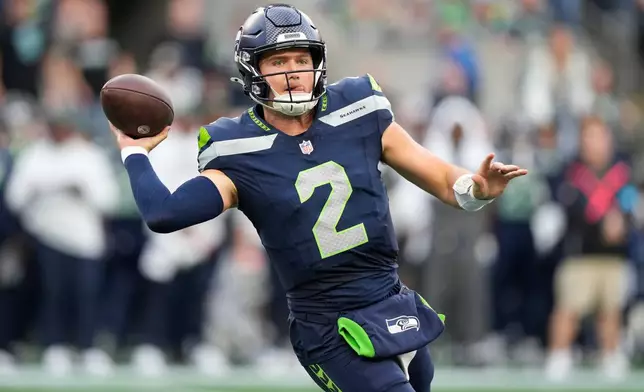 Seattle Seahawks quarterback Drew Lock throws a pass during the first half of an NFL football game against the New England Patriots, Wednesday, Sept. 9, 2026, in Seattle. (AP Photo/Stephen Brashear)