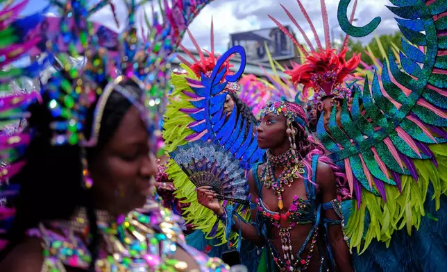 Revellers celebrate the Notting Hill Carnival in London, Monday, Aug. 31, 2026. (AP Photo/Ohad Zwigenberg)