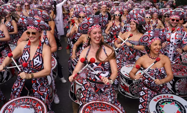 Revellers celebrate Notting Hill Carnival in London, Monday, Aug. 31, 2026, Europe's biggest street party and one of the largest carnivals in the world. (AP Photo/Alberto Pezzali)
