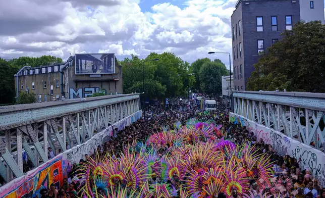 Revellers celebrate the Notting Hill Carnival in London, Monday, Aug. 31, 2026. (AP Photo/Ohad Zwigenberg)