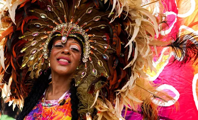 A reveller celebrates the Notting Hill Carnival in London, Monday, Aug. 31, 2026. (AP Photo/Alberto Pezzali)