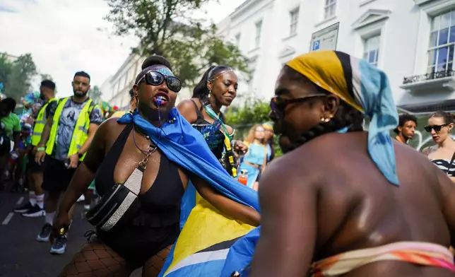 Revellers celebrate the Notting Hill Carnival in London, Monday, Aug. 31, 2026. (AP Photo/Alberto Pezzali)
