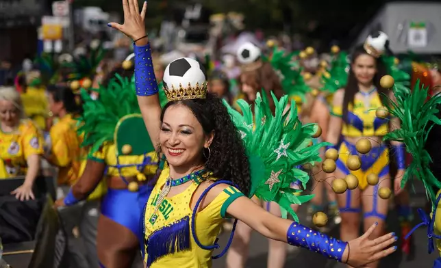 Revellers celebrate Notting Hill Carnival in London, Monday, Aug. 31, 2026, Europe's biggest street party and one of the largest carnivals in the world. (AP Photo/Alberto Pezzali)