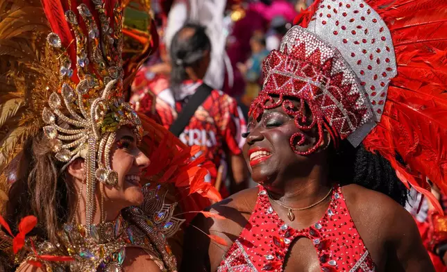Revellers celebrate Notting Hill Carnival in London, Monday, Aug. 31, 2026, Europe's biggest street party and one of the largest carnivals in the world. (AP Photo/Alberto Pezzali)