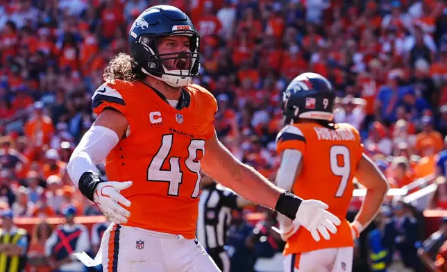 Denver Broncos linebacker Alex Singleton (49) celebrates after the Broncos stopped a drive by the Jacksonville Jaguars in the second half of an NFL football game in Denver, Sunday, Sept. 20, 2026. (AP Photo/David Zalubowski)