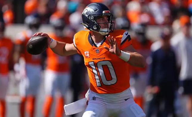 Denver Broncos quarterback Bo Nix passes against the Jacksonville Jaguars in the first half of an NFL football game in Denver, Sunday, Sept. 20, 2026. (AP Photo/David Zalubowski)