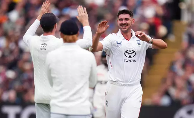 England's Josh Tongue, right, celebrates the wicket of Pakistan's Ghazi Ghori, during day one of the third cricket test match between England and Pakistan, at Edgbaston, in Birmingham, England, Wednesday, Sept. 9, 2026. (Mike Egerton/PA via AP)