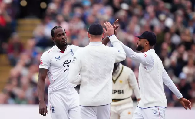 England's Jofra Archer, left, celebrates the wicket of Pakistan's Azan Awais, during day one of the third cricket test match between England and Pakistan, at Edgbaston, in Birmingham, England, Wednesday, Sept. 9, 2026. (Mike Egerton/PA via AP)