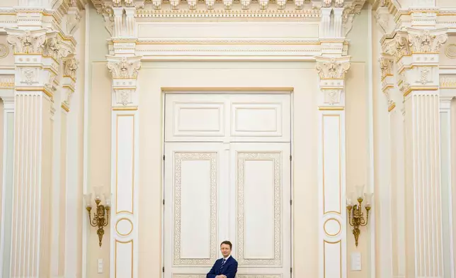 Romanian Prime Minister designate Siegfried Muresan poses after an interview with the Associated Press at the Palace of Parliament in Bucharest, Romania, Monday, Sept. 28, 2026. (AP Photo/Andreea Alexandru)