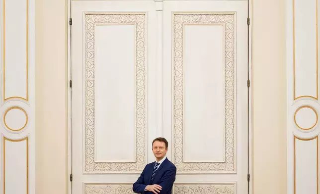 Romanian Prime Minister designate Siegfried Muresan poses after an interview with the Associated Press at the Palace of Parliament in Bucharest, Romania, Monday, Sept. 28, 2026. (AP Photo/Andreea Alexandru)