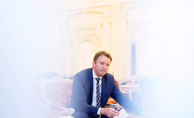 Romanian Prime Minister designate Siegfried Muresan speaks during an interview with the Associated Press at the Palace of Parliament in Bucharest, Romania, Monday, Sept. 28, 2026. (AP Photo/Andreea Alexandru)