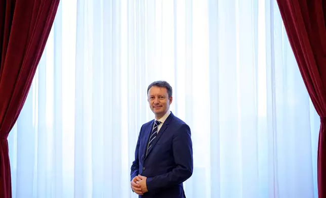 Romanian Prime Minister designate Siegfried Muresan poses after an interview with the Associated Press at the Palace of Parliament in Bucharest, Romania, Monday, Sept. 28, 2026. (AP Photo/Andreea Alexandru)