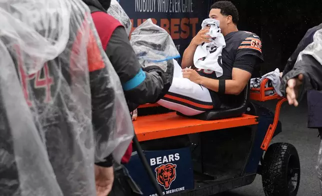 Chicago Bears quarterback Caleb Williams is carted off the field after an injury during the second half of an NFL football game against the Minnesota Vikings in Chicago, Sunday, Sept. 20, 2026. (AP Photo/Nam Y. Huh)