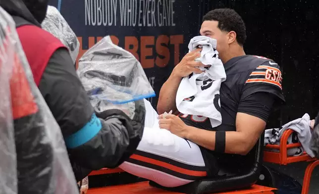 Chicago Bears quarterback Caleb Williams is carted off the field after an injury during the second half of an NFL football game against the Minnesota Vikings in Chicago, Sunday, Sept. 20, 2026. (AP Photo/Nam Y. Huh)