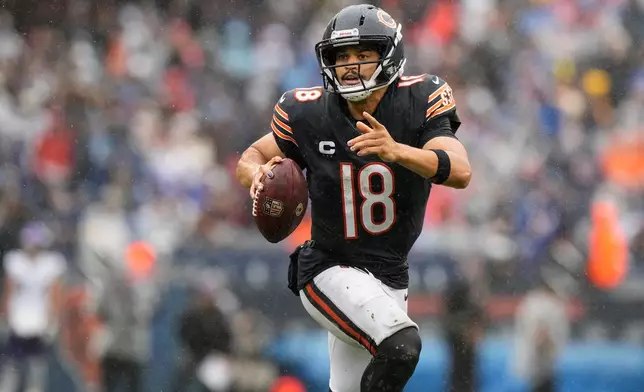 Chicago Bears quarterback Caleb Williams (18) runs with the football during the second half of an NFL football game against the Minnesota Vikings in Chicago, Sunday, Sept. 20, 2026. (AP Photo/Nam Y. Huh)