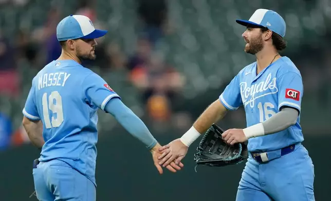 Kansas City Royals' Michael Massey (19) and John Rave (16) celebrate after a baseball game against the Houston Astros Wednesday, Sept. 16, 2026, in Houston. (AP Photo/David J. Phillip)