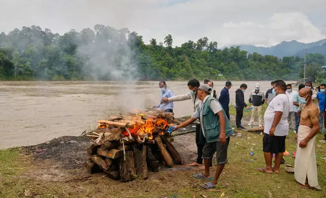 Relatives and friends cremate Aayush Khada, who was killed in flash floods, in Chitwan, Nepal, Monday, Aug. 31, 2026. (AP Photo/Dar Yasin)