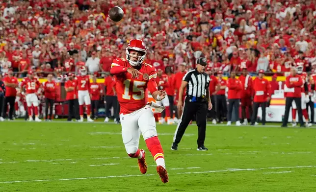 Kansas City Chiefs quarterback Patrick Mahomes throws a touchdown pass to wide receiver Xavier Worthy during the first half of an NFL football game against the Indianapolis Colts Sunday, Sept. 20, 2026, in Kansas City, Mo. (AP Photo/Charlie Riedel)