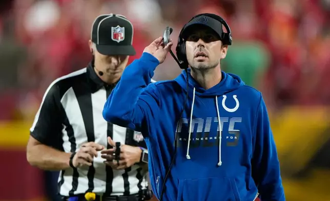 Indianapolis Colts head coach Shane Steichen looks at a replay during a review during overtime of an NFL football game against the Kansas City Chiefs Sunday, Sept. 20, 2026, in Kansas City, Mo. (AP Photo/Charlie Riedel)