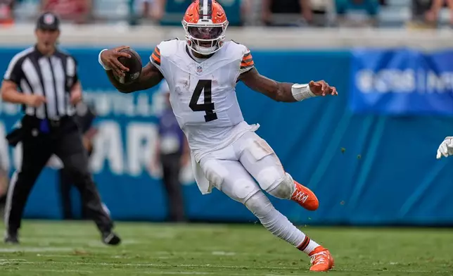 Cleveland Browns quarterback Deshaun Watson (4) scrambles in the first half of an NFL football game against the Jacksonville Jaguars, Sunday, Sept. 13, 2026, in Jacksonville. (AP Photo/Mike Stewart)