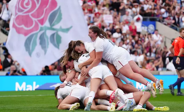 England celebrate the winning try during the WXV Global Series match between England and New Zealand in London, Saturday Sept. 26, 2026. (David Davies/PA via AP)