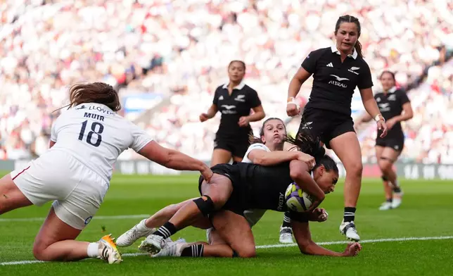 New Zealand's Mererangi Paul scores a try during the WXV Global Series match between England and New Zealand in London, Saturday Sept. 26, 2026. (David Davies/PA via AP)