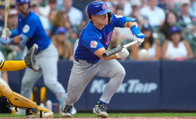 Chicago Cubs' Matt Shaw hits a sacrifice bunt during the sixth inning of a baseball game against Milwaukee Brewers Monday, Sept. 7, 2026, in Milwaukee. (AP Photo/Kayla Wolf)