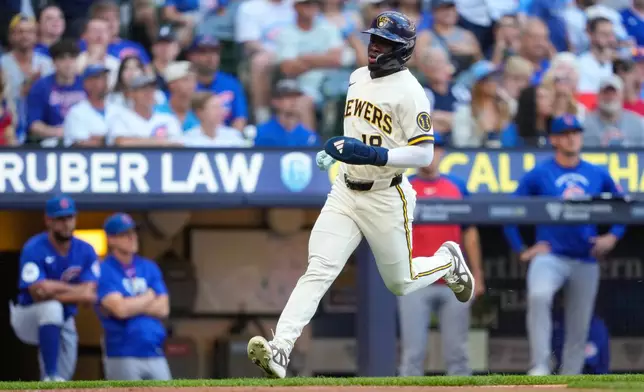 Milwaukee Brewers' Luis Lara scores on an RBI single hit by Garrett Mitchell during the fifth inning of a baseball game against the Chicago Cubs Monday, Sept. 7, 2026, in Milwaukee. (AP Photo/Kayla Wolf)