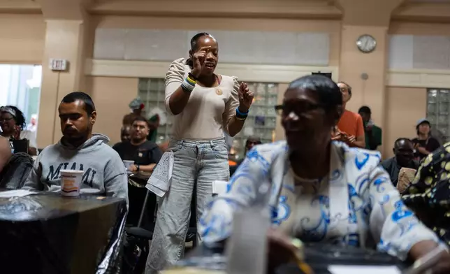 A contestant who goes by the nickname Lil Bit dances while watching another contestant perform during Skid Row's inaugural talent show in downtown Los Angeles, Saturday, Sept. 19, 2026. (AP Photo/Jae C. Hong)