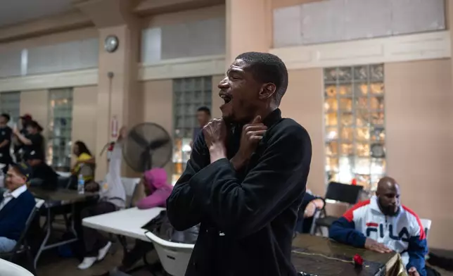 DeAndre Owens reacts as he watches a contestant perform during Skid Row's inaugural talent show in downtown Los Angeles, Saturday, Sept. 19, 2026. (AP Photo/Jae C. Hong)