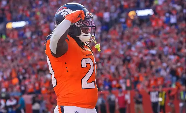 Denver Broncos running back Jonah Coleman celebrates after scoring a touchdown against the Jacksonville Jaguars in the second half of an NFL football game in Denver, Sunday, Sept. 20, 2026. (AP Photo/David Zalubowski)