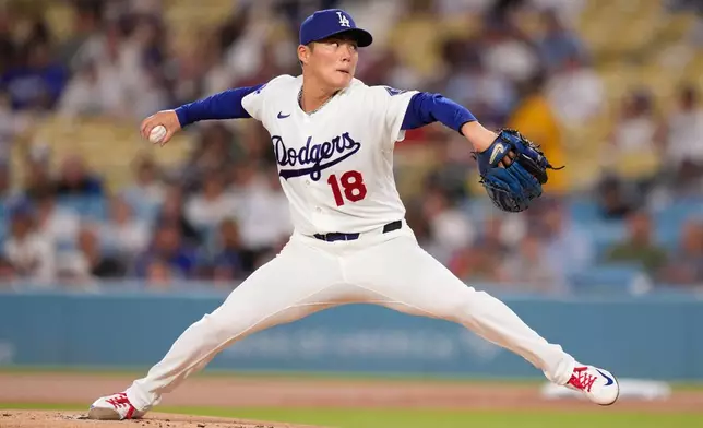Los Angeles Dodgers pitcher Yoshinobu Yamamoto throws to the plate during the first inning of a baseball game against the Cincinnati Reds, Wednesday, Sept. 9, 2026, in Los Angeles. (AP Photo/Mark J. Terrill)