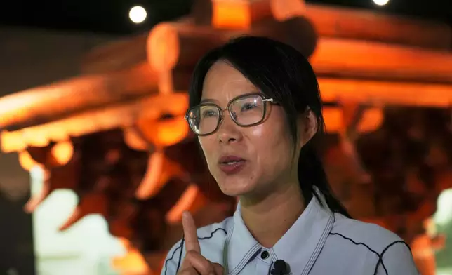 Cai Hongping speaks to a reporter as she visits the Wudang Museum in central China's Hubei Province on Sept, 4, 2026. (AP Photo/Achmad Ibrahim)