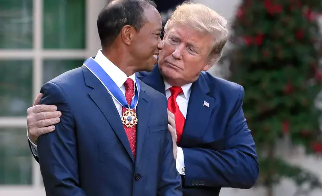 FILE - President Donald Trump, right, presents the Presidential Medal of Freedom to Tiger Woods during a ceremony in the Rose Garden of the White House in Washington, May 6, 2019. (AP Photo/Manuel Balce Ceneta, File)
