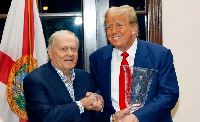 FILE - Republican presidential candidate former President Donald Trump, right, shakes hands with retired golfer Jack Nicklaus during the Club Golf Awards at Trump International Golf Course in West Palm Beach, Fla., March 24, 2024. (AP Photo/Terry Renna, File)