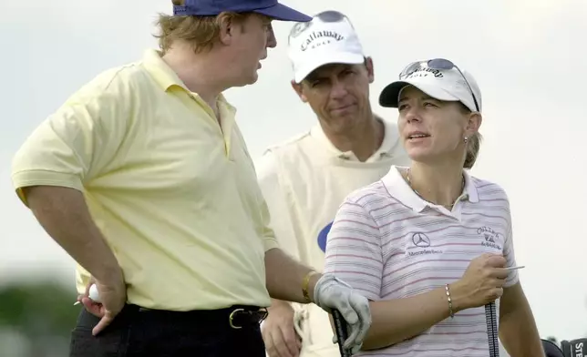 FILE - Donald Trump, left, talks with Annika Sorenstam, of Stockholm, Sweden, during the LPGA Tour Championships ProAm round as they wait to tee off on the 15th tee at the Trump International Gulf Club, Nov. 20, 2002, in West Palm Beach, Fla. (AP Photo/Marta Lavandier, File)
