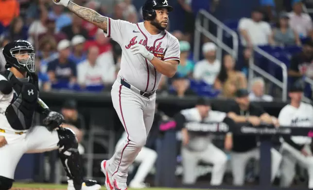 Atlanta Braves' Michael Harris II follows through on a two run home run during the second inning of a baseball game against the Miami Marlins, Saturday, Sept. 26, 2026, in Miami. (AP Photo/Lynne Sladky)