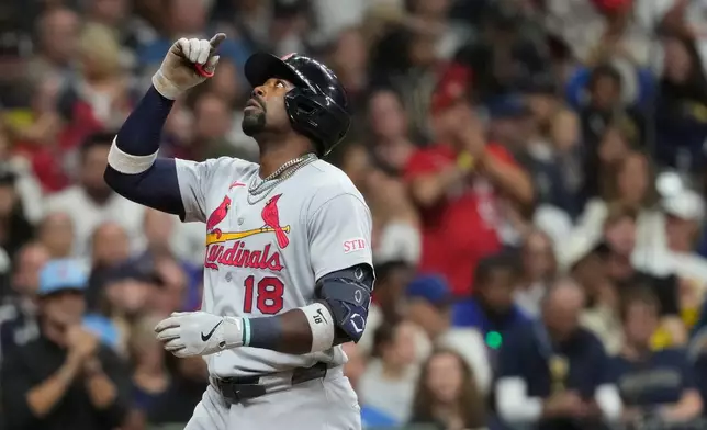 St. Louis Cardinals' Jordan Walker gestures as he rounds the bases after hitting a solo home run during the seventh inning of a baseball game against the Milwaukee Brewers, Friday, Sept. 25, 2026, in Milwaukee. (AP Photo/Aaron Gash)